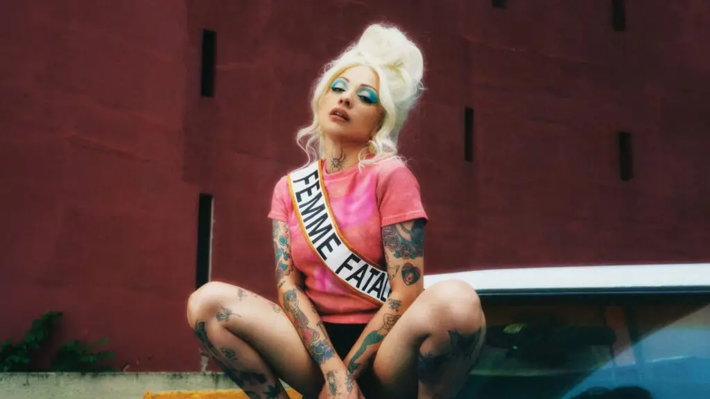 Mon Laferte wearing a Femme Fatale sash, official promotional photo for her 2026 North American tour