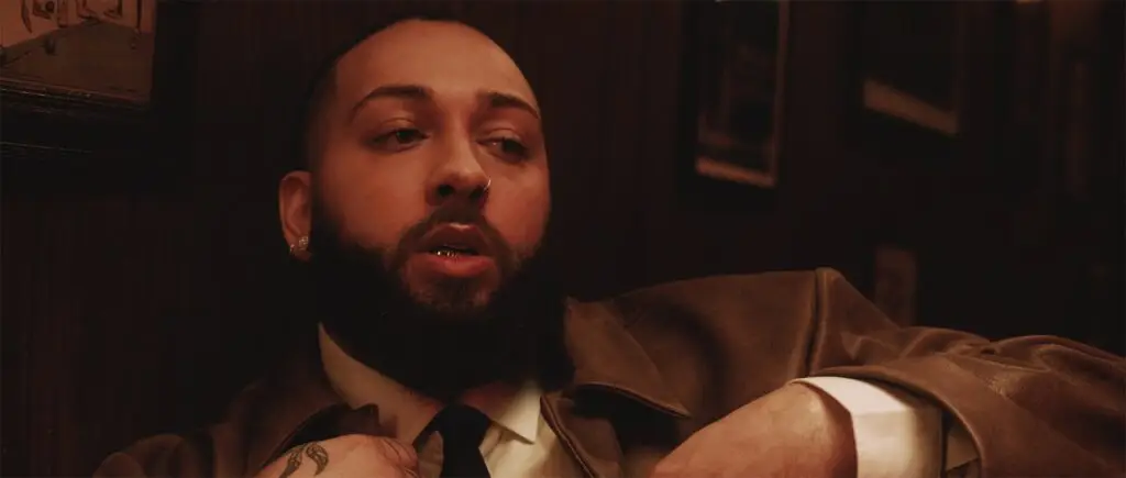 Isaiah Falls in a cinematic promotional portrait for the LVRS PARADISE - SIDE B Tour