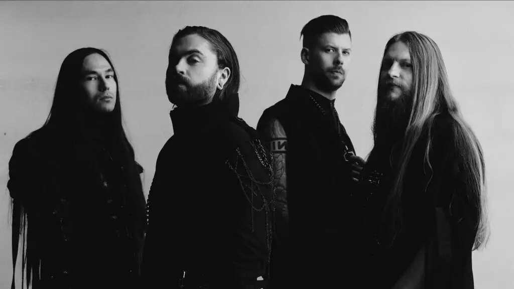 Imminence band press photo, four members in dark metalcore styling