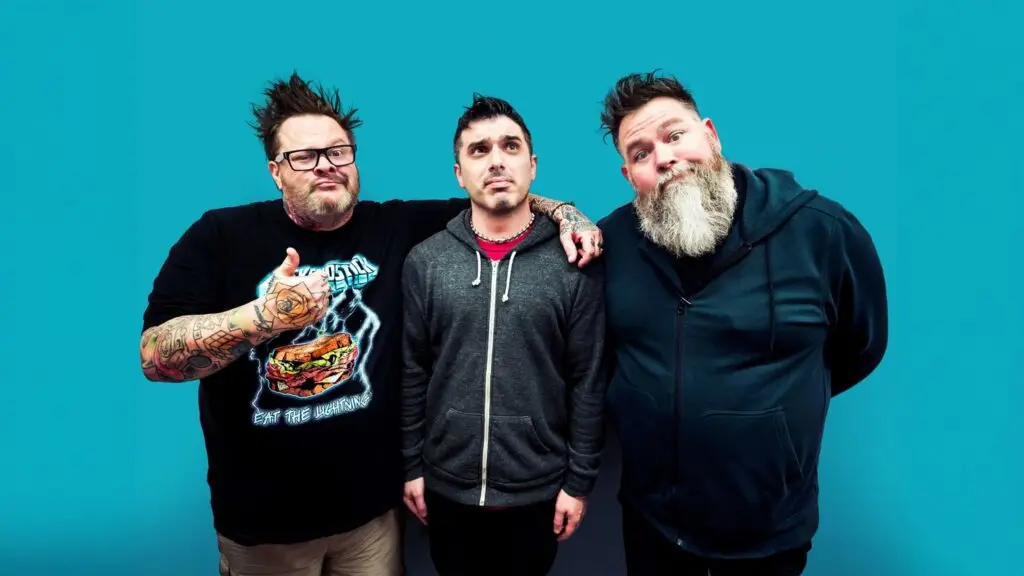 Bowling for Soup band members in official promotional photo against teal background