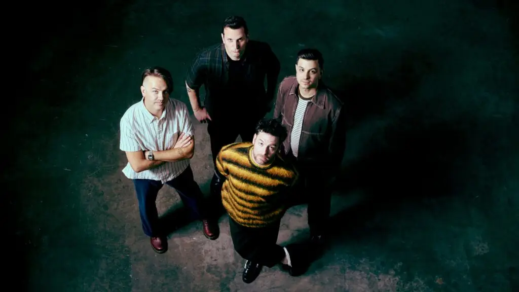 Senses Fail band members photographed from above in moody atmospheric studio lighting