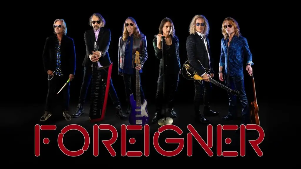 Foreigner band members pose with instruments in official promotional photo