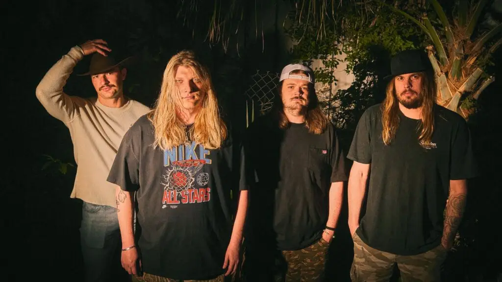 Dexter and The Moonrocks band promo photo, four members in moody outdoor nighttime setting