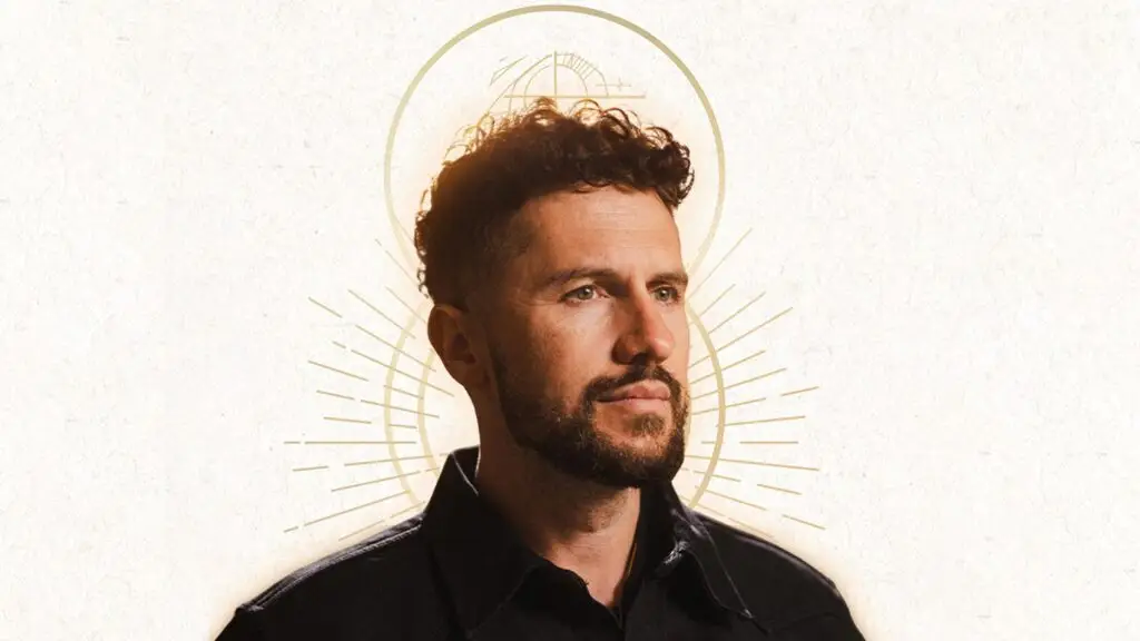 Ruslan KD official press photo with golden halo design, Godly Ambition Tour 2026