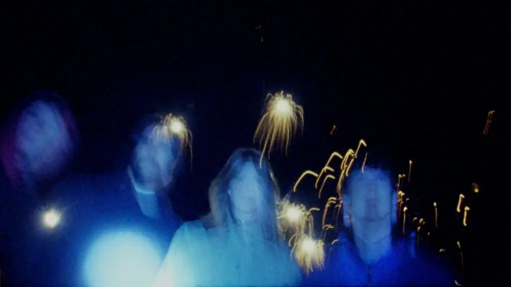 Slow Pulp — four-piece band in atmospheric blue-lit motion-blur press photo